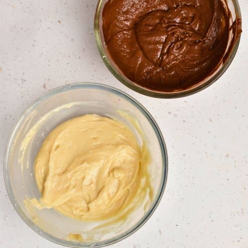 Two bowls of Marble Pound Cake batter, one with chocolate.