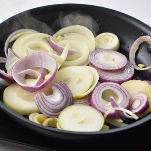 onions cooking in a pan.