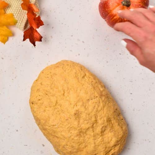 Pumpkin Bread Roll dough on a table.