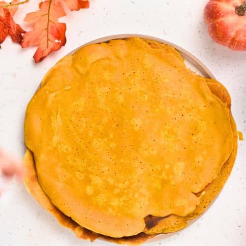 Stacking Pumpkin Crepes  on a plate.