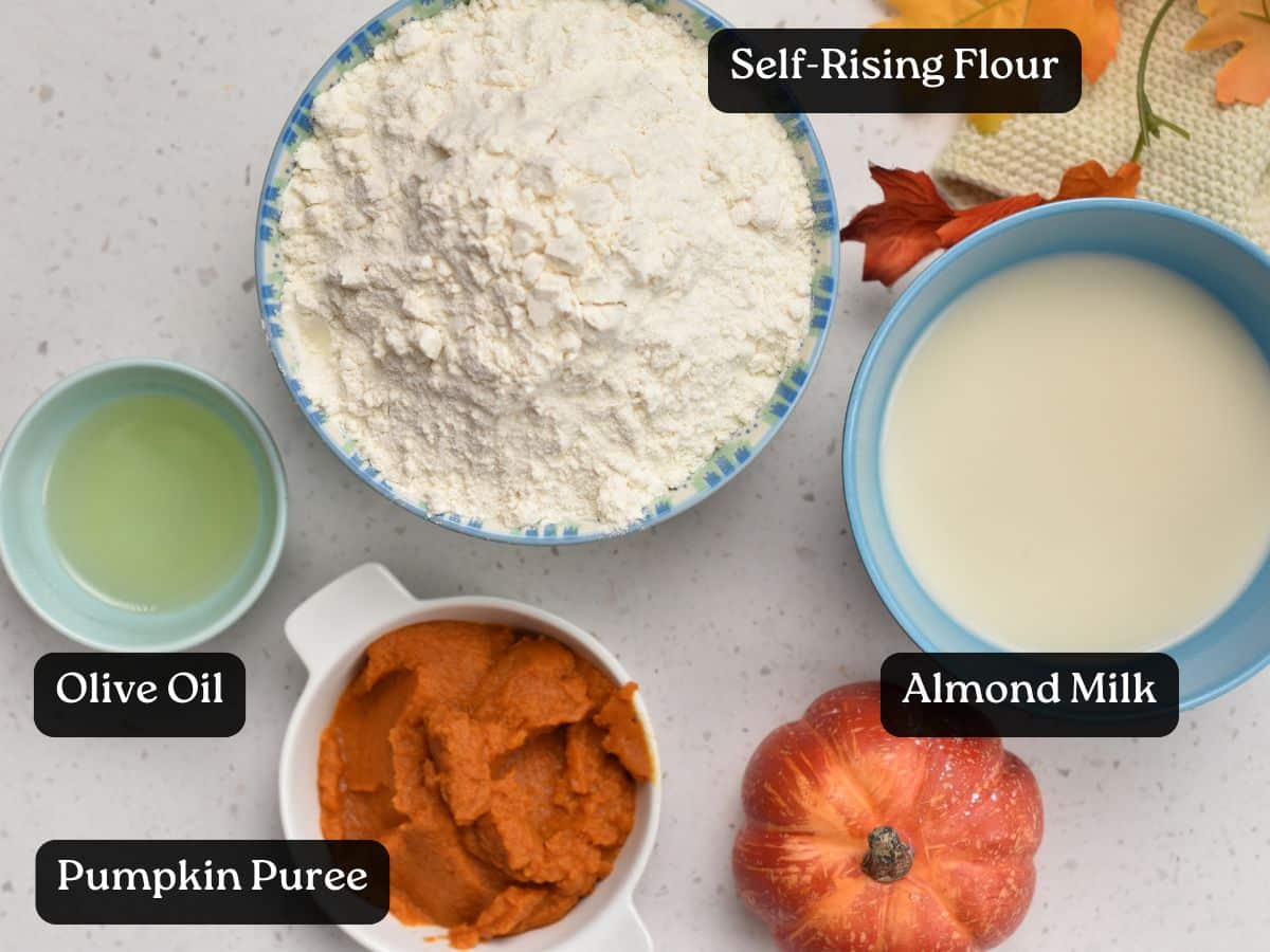 Ingredients for Pumpkin Bread Rolls in bowls and ramekins.