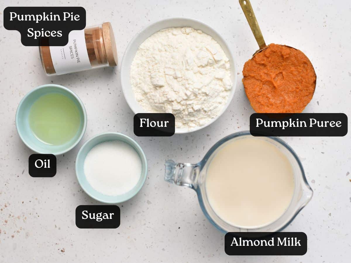 Ingredients for Pumpkin Crepes in bowls and cups.