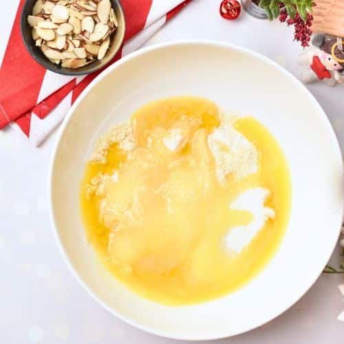 Almond Christmas Cookie dough ingredients in a mixing bowl.