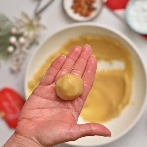 Almond Cookie dough rolled into a ball.