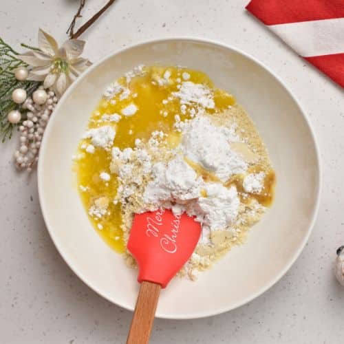 Vegan butter and powdered sugar in a mixing bowl.