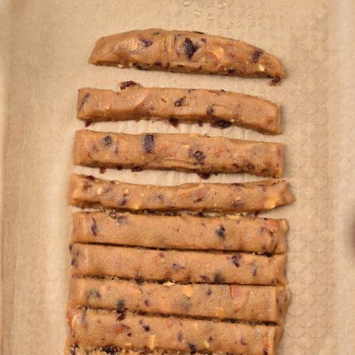 Sliced Almond Cranberry Cookies on a baking sheet.