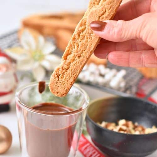 Dipping Almond Flour Biscotti into melted chocolate