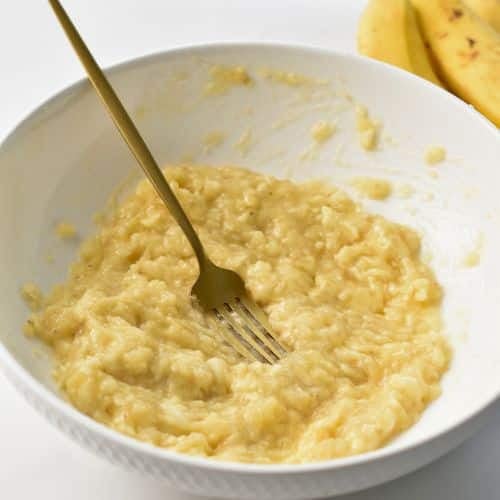 Mashed banana in a bowl.