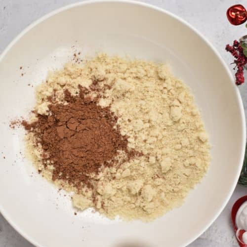 Chocolate Almond Thumbprint Cookie dry dough ingredients in a mixing bowl.