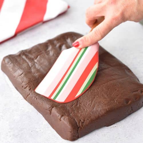 Forming a large dough block with a silicone spatula.