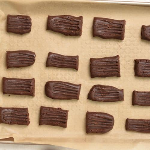 Cut Chocolate Shortbread Cookies on a baking sheet.