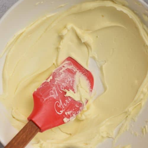 Dairy-free butter and powdered sugar in a mixing bowl.