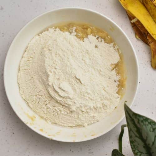 Cinnamon Banana Bread batter ingredients in a bowl.