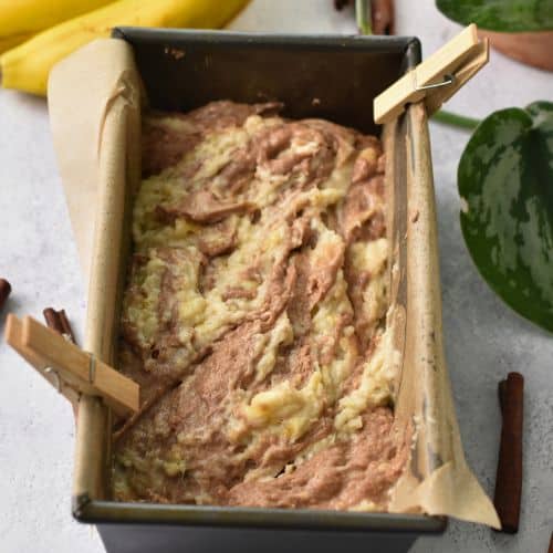 Swirled Cinnamon Banana Bread batter in a loaf pan.