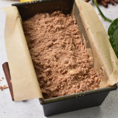 Cinnamon sugar on top of the Cinnamon Banana Bread dough in a loaf pan.