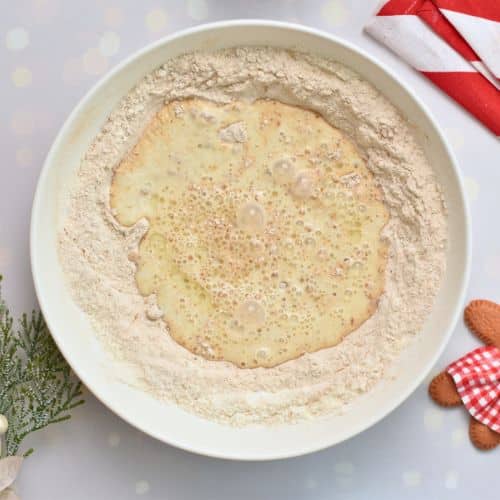 Adding wet ingredients to the dry Gingerbread Pancake ingredients.