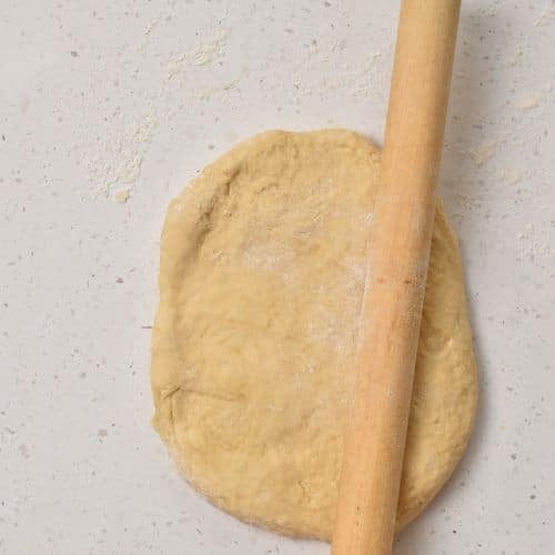 Rolling Healthy Cinnamon Roll dough.