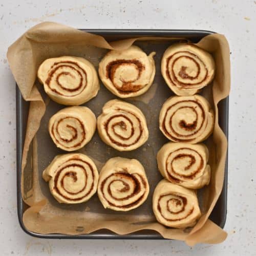 Healthy Cinnamon Rolls cut and place into a pan.