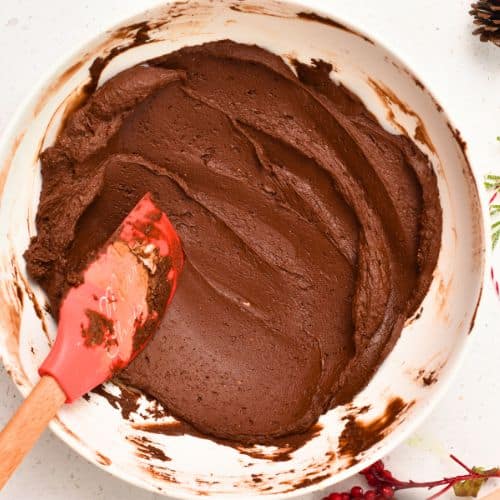 Healthy Truffle batter in a large mixing bowl with a silicone spatula.