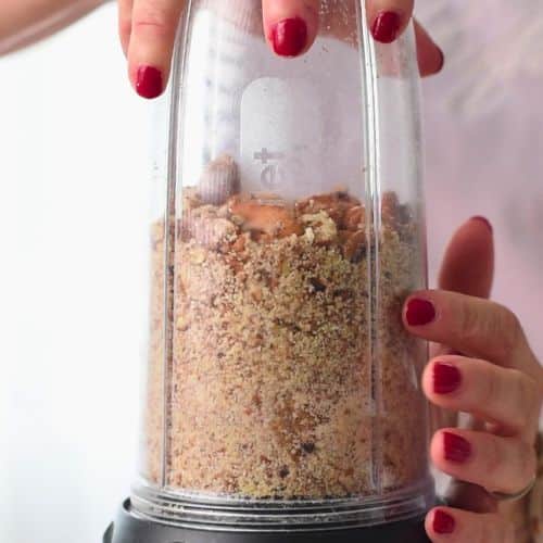 Grinding pecans in a blender.