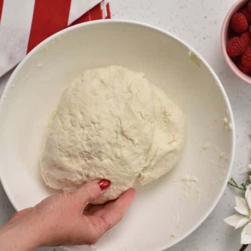 Ball of Pull Apart Christmas Tree Bread dough in bowl.