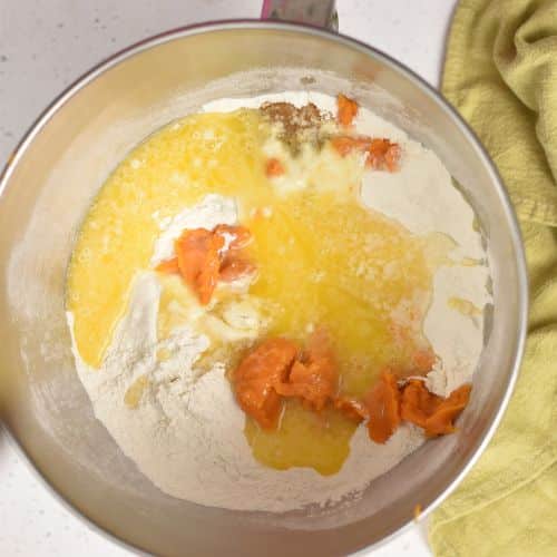 Sweet Potato Cinnamon Roll dough ingredients in a large mixing bowl.