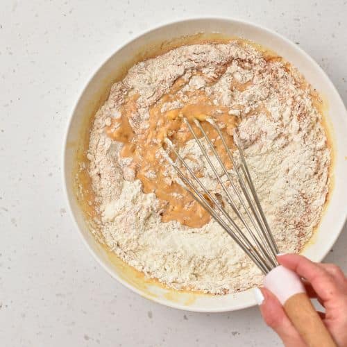 Combining Sweet Potato Pancake ingredients.