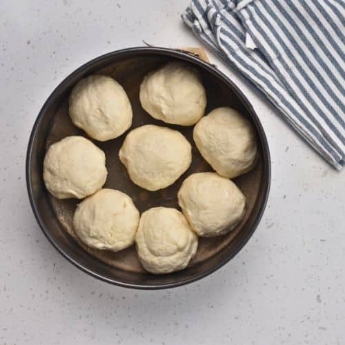 3-Ingredient Dinner Rolls ready to bake in a pan.