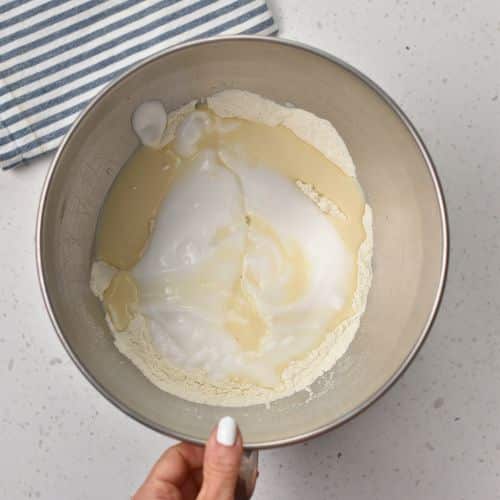 3-Ingredient Dinner Roll ingredients in the bowl of a stand mixer.