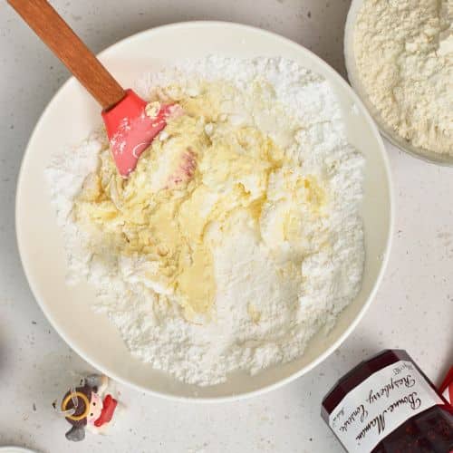 Dairy-free butter and powdered sugar in a mixing bowl.