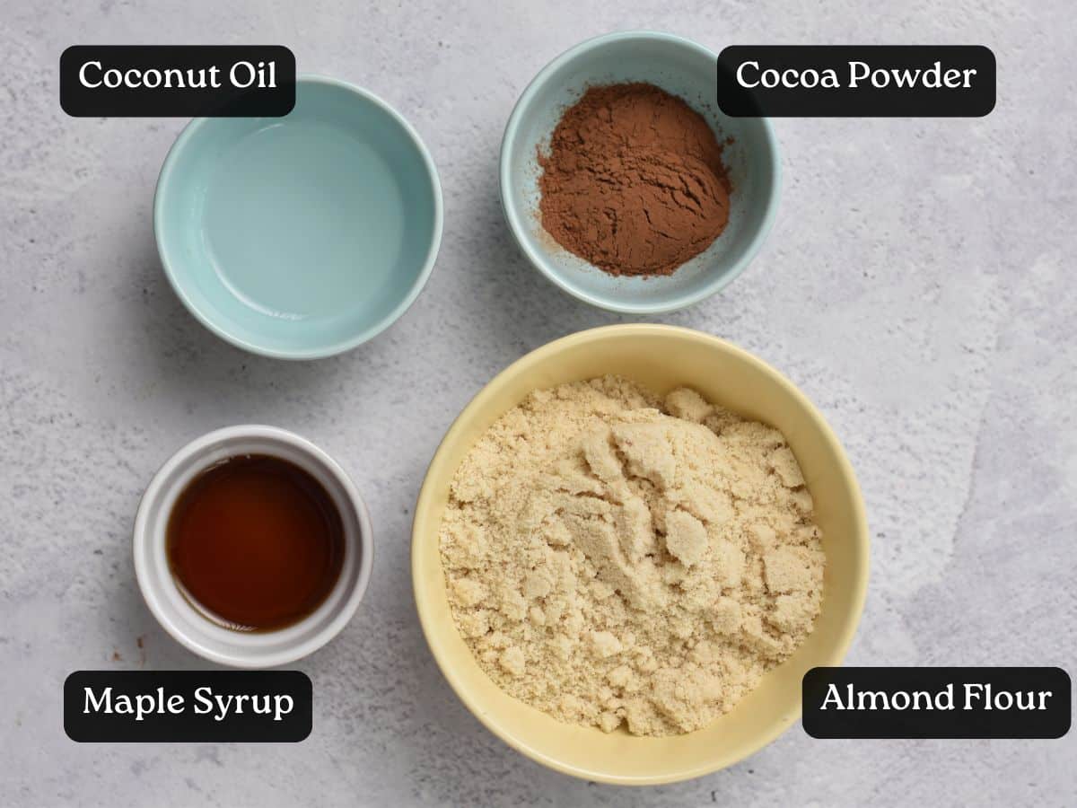 Ingredients for Chocolate Almond Thumbprint Cookies in bowls and ramekins.