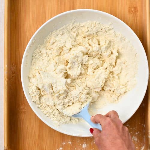 Stirring the 2-Ingredient Dough with a silicone spatula.