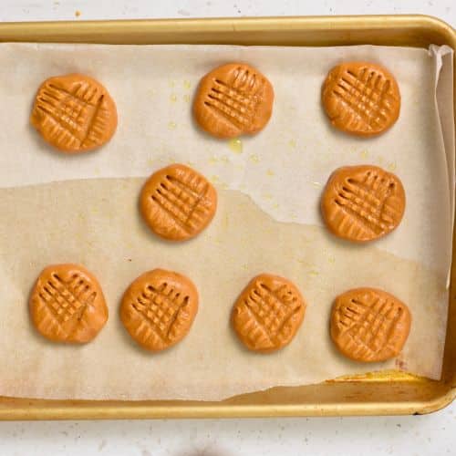 3-Ingredient Peanut Butter Cookies ready to bake on a baking sheet.