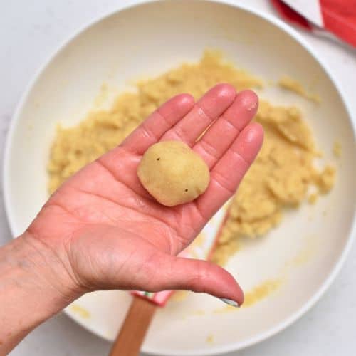 Almond Cloud Cookie dough rolled into a ball.