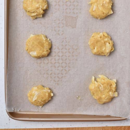 Almond Flour Coconut Cookies ready to bake on a cookie sheet.