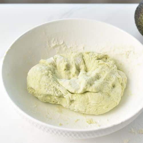 Avocado Bagel dough in a bowl.