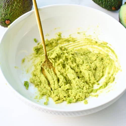 Mashed avocados in a bowl.