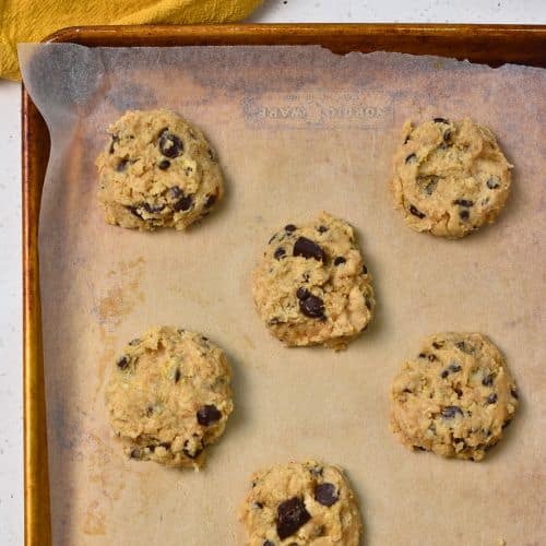 Banana Chocolate Chip Cookies ready to bake on a cookie sheet.