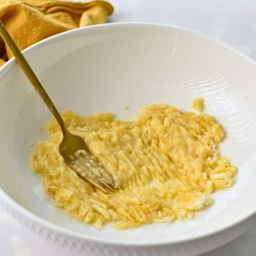 Mashed banana in a bowl.