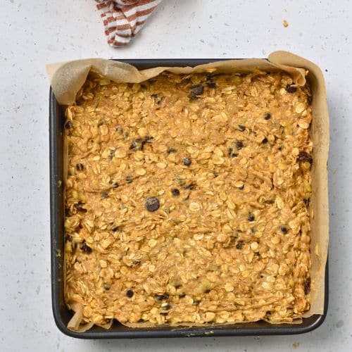 Banana Oat Bars ready to bake in a pan.