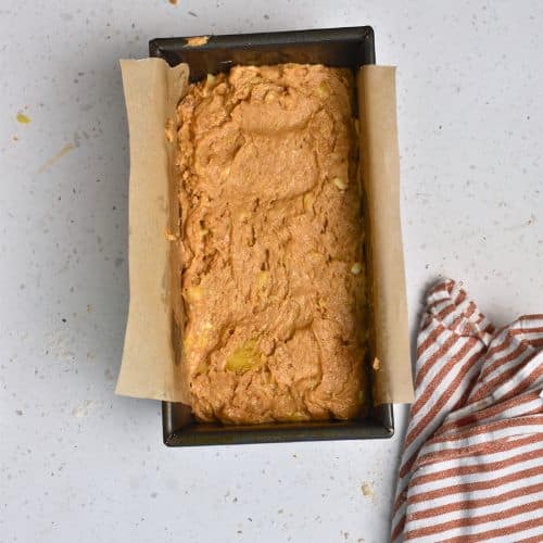 Biscoff Banana Bread dough in a loaf pan.