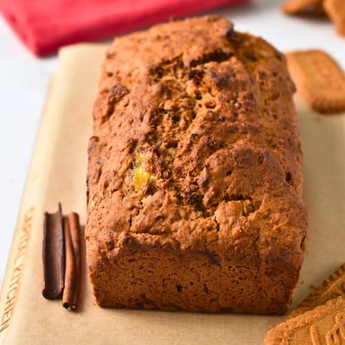 Biscoff Banana Bread cooling down on a chopping board.