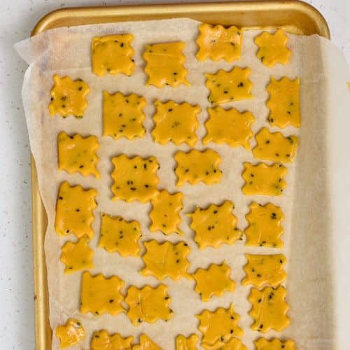 Chickpea Crackers ready to bake on a baking sheet.