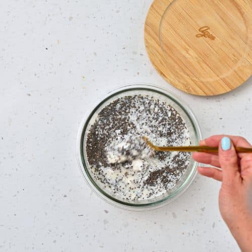 Adding milk to the Coconut Chia Pudding base ingredients.