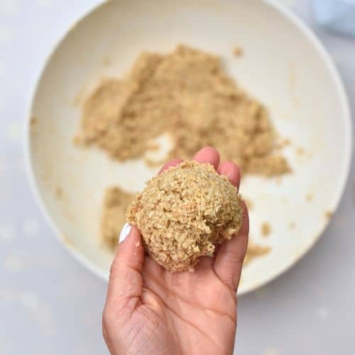 Rolling a Crispy Oatmeal Cookie dough ball.