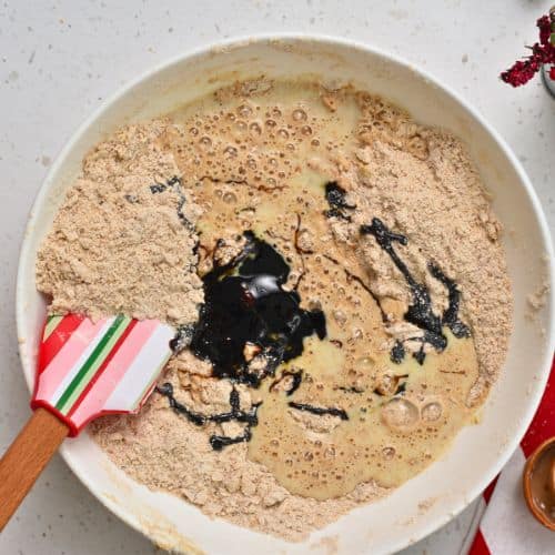 Incorporating molasses into Gingerbread Scones.