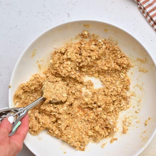 Scooping Healthy Banana Cookie dough with a cookie scoop.