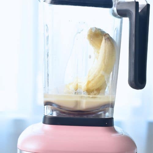 Making the banana milk in a blender.