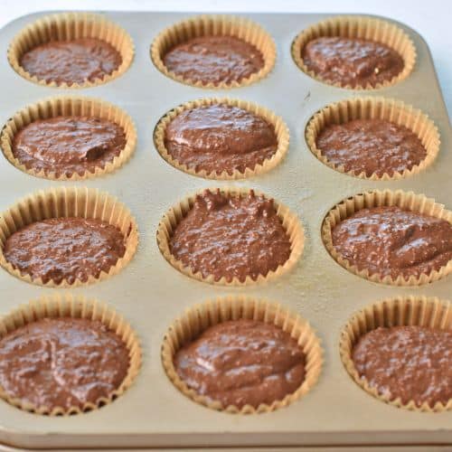 Healthy Chocolate Muffins ready to bake in a muffin tin.