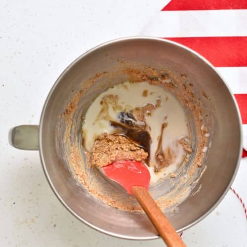 Adding liquid ingredients to Healthy Gingerbread Cookie dough base.